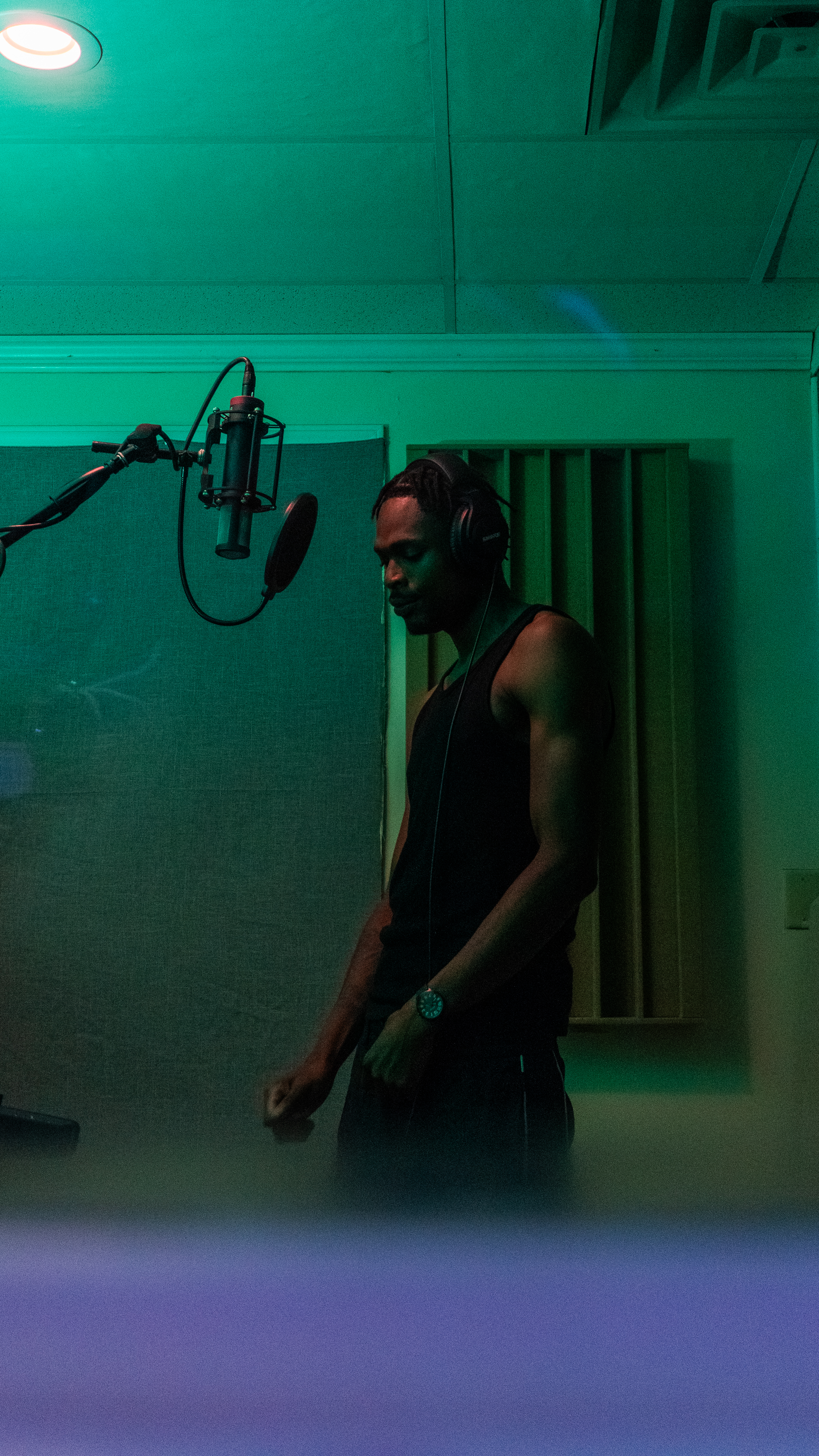 Artist in the booth working on melody ideas